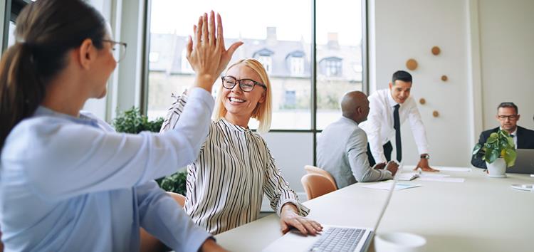 A person giving a high five to a person
